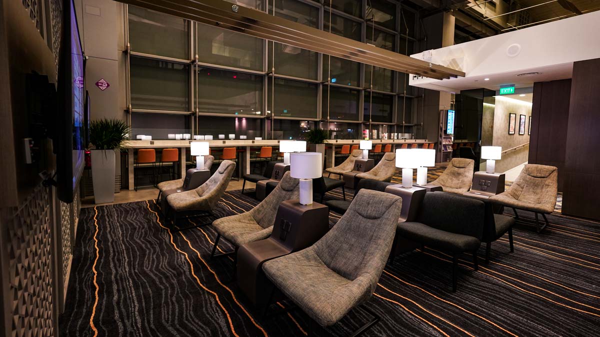 Reclined lounge seats at Marhaba lounge Changi Airport - multi currency card and miles credit card