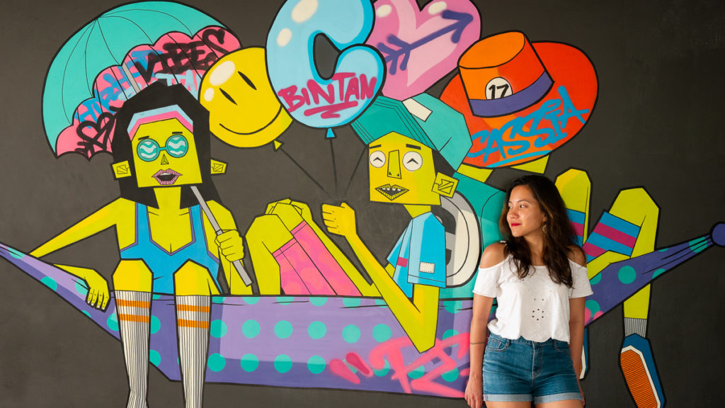Posing in front of Cassia Bintan's wall decor - Bintan itinerary