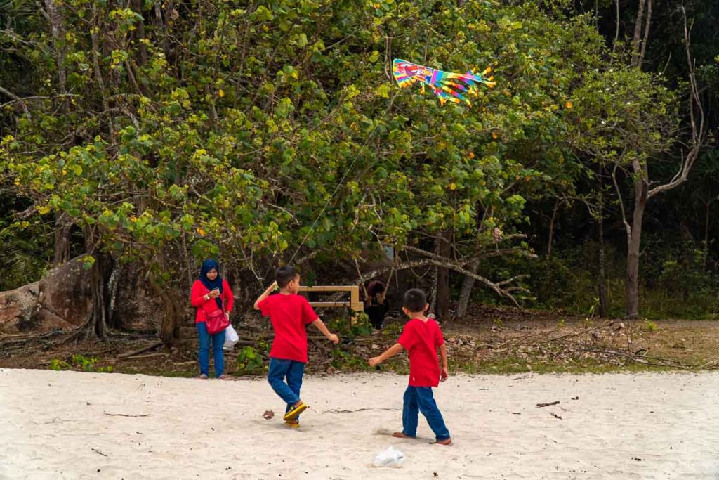 Kids Flying Kite at Teluk Chempedak - Kuantan Guide