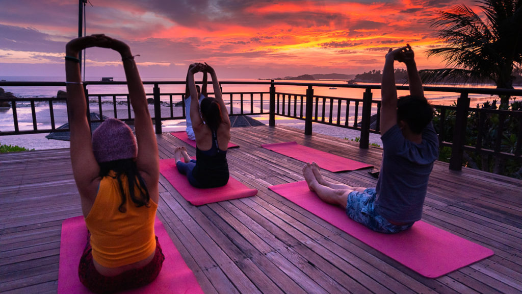 Morning yoga against the sunrise