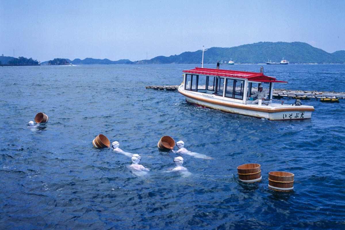 Ama Swimming in Ocean in Toba