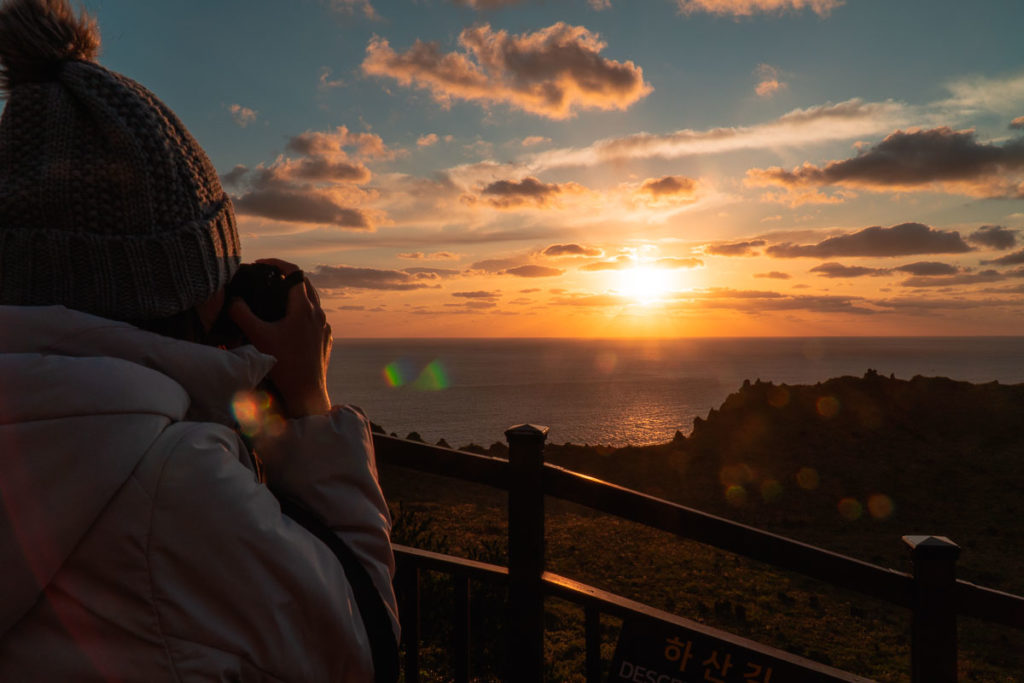 Taking Photos of Sunrise at Seongsan Ilchubong Sunrise Peak - Jeju Itinerary