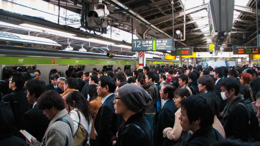 Tokyo subway station rush hour crowd - Japan Travel Tips Peak Season