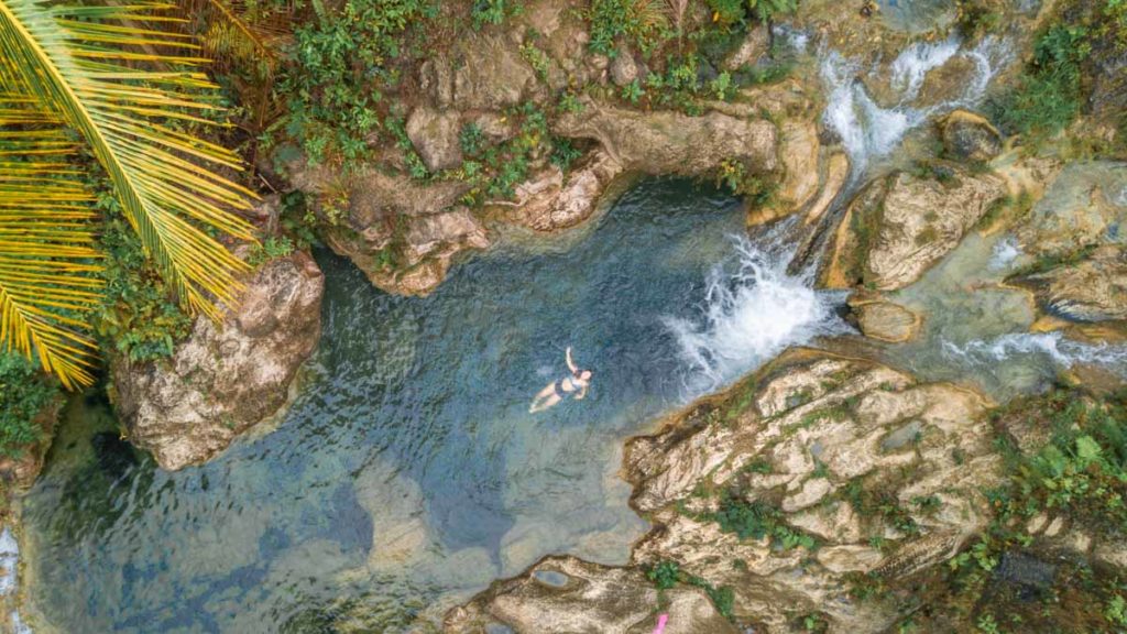 Girl-Floating-at-Inambakan-Falls-Things-to-do-in-Cebu-Philippines