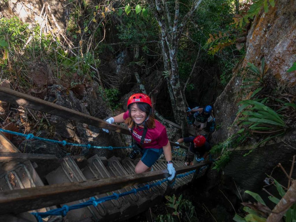 Ascending from the tight limestone caves of Ugong Rock - Puerto Princesa Itinerary 