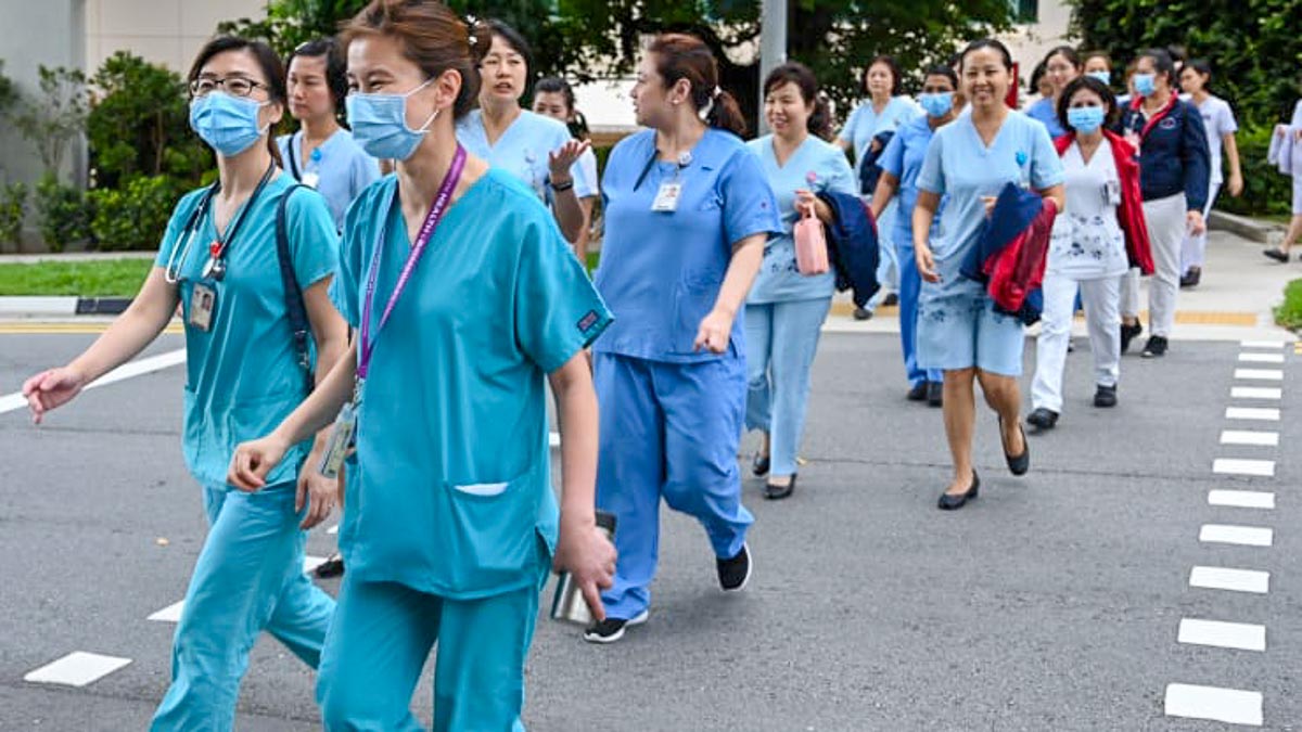 Singaporean Nurses Crossing A Street - Qatar Thanks Healthcare Workers