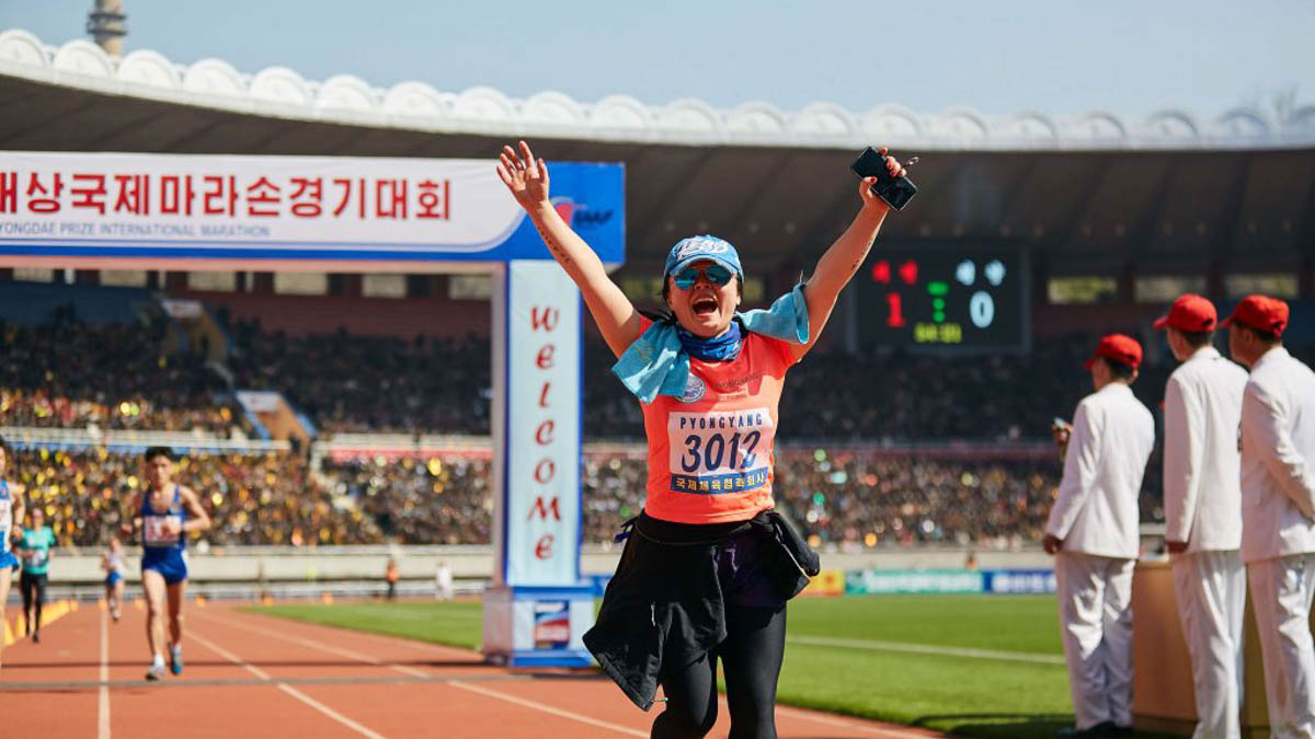 Woman running Pyongyang Marathon - pushing your comfort zone