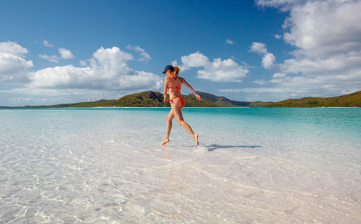Lady Running on Whitehaven Beach - Places to Visit in Australia