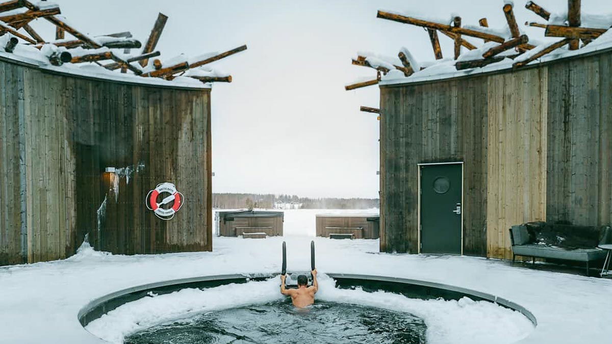 Arctic Bath Man Coming Out of Cold Pool - Travel Bucket List