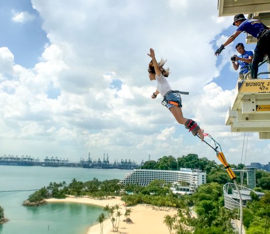 Girl Bungy Jumping AJ Heckett - Things to do in Singapore