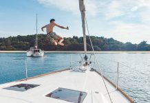 Guy jumping off a yacht - Yacht Getaway