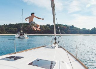 Guy jumping off a yacht - Yacht Getaway