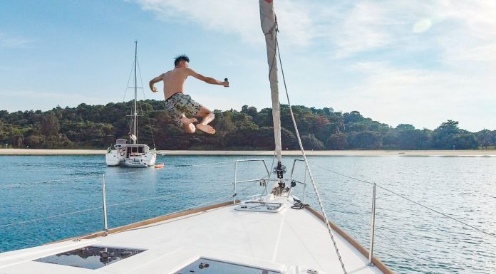 Guy jumping off a yacht - Yacht Getaway