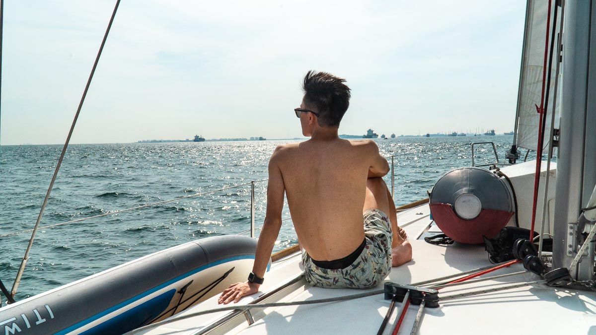 Guy on a yacht - SingapoRediscovers Vouchers