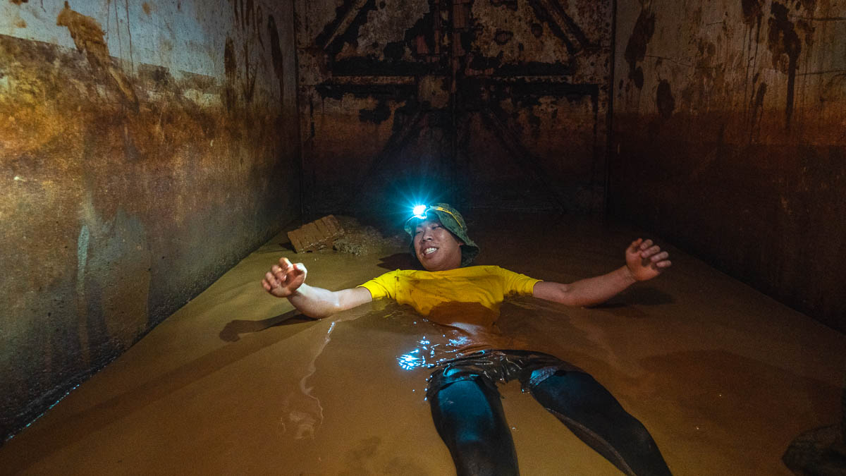 Boy Lying In Mud Marsiling Tunnels South