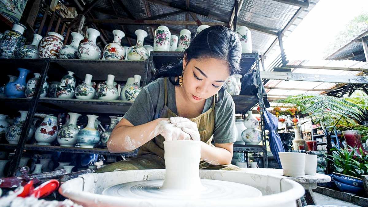 Girl doing pottery — Things To Do Singapore
