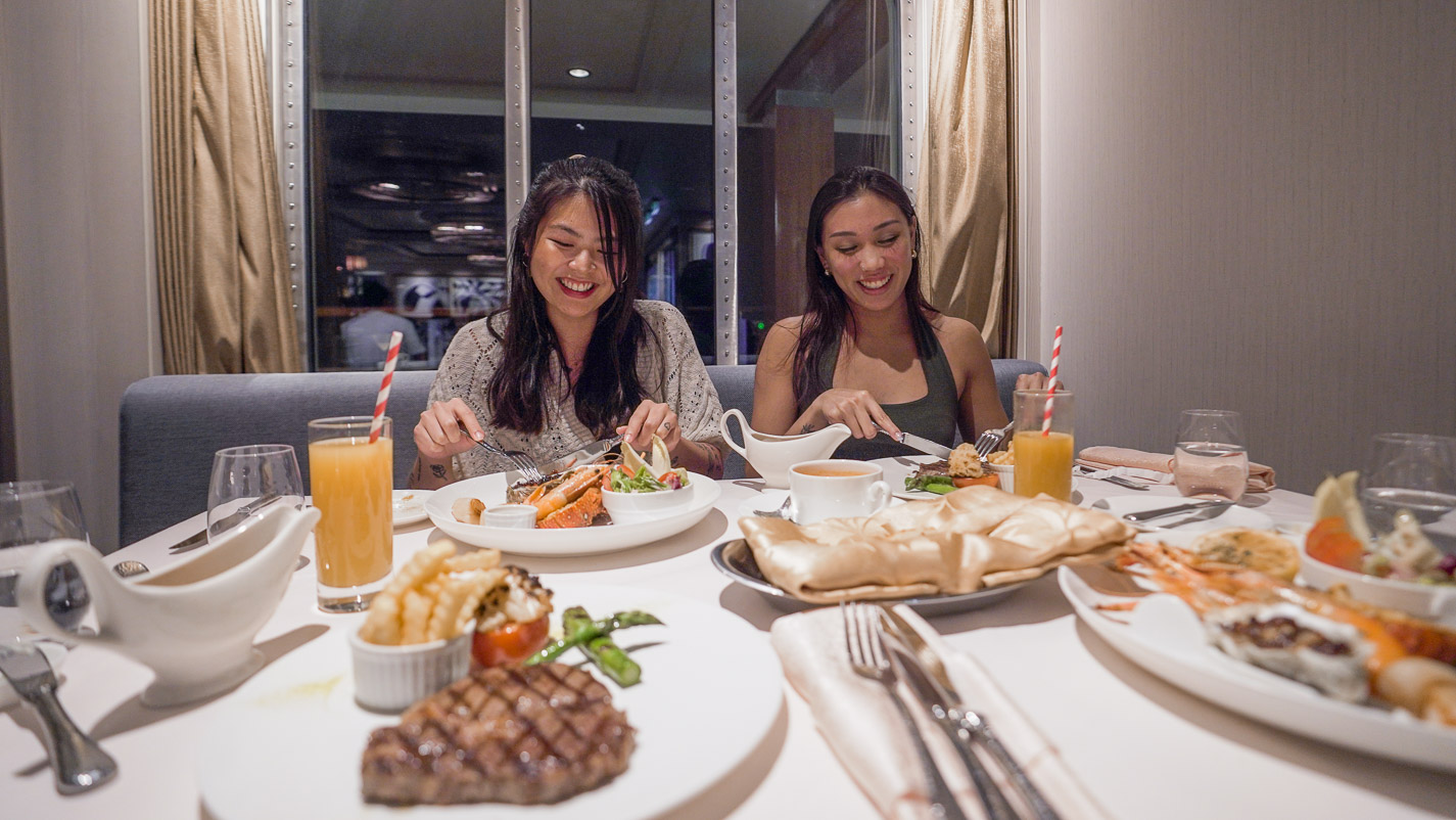 Girls Enjoying Dinner Steak and Seafood Grill Bistro By Mark Best