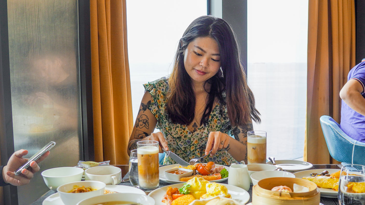 Girl Eating Complimentary Breakfast 