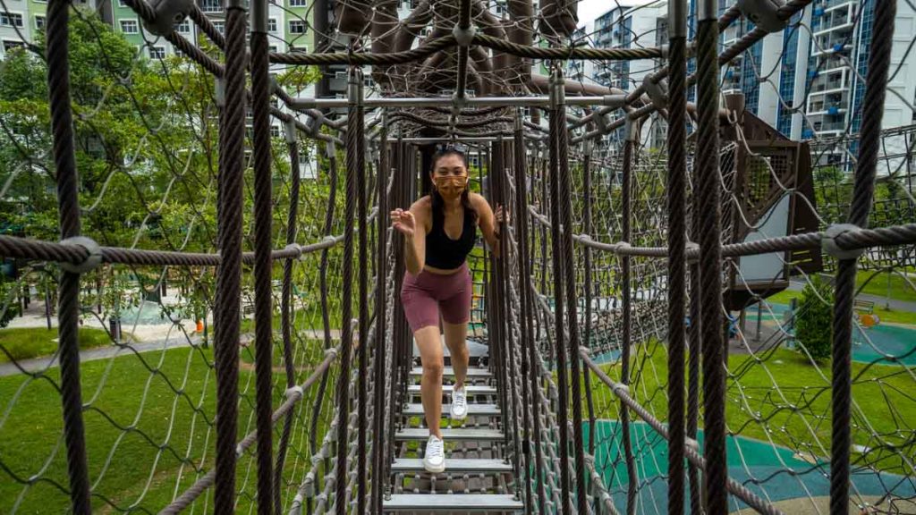 Girl on High Element Playground at Tampines Green Forest Park — Outdoor Activities in Singapore
