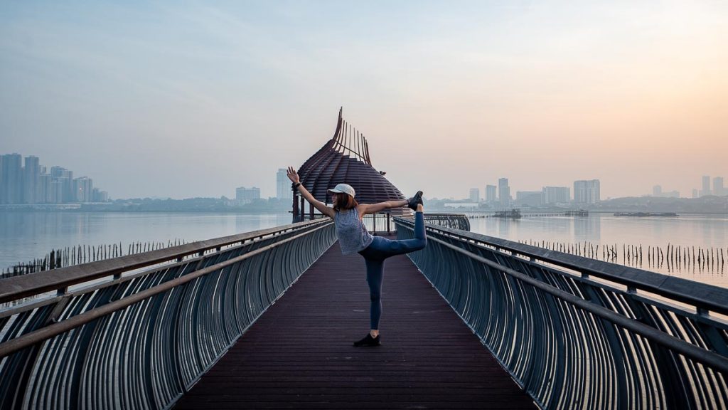 Hiker doing Yoga Pose at Eagle Point along the Coastal Trail - Sungei Buloh Wetland Reserve Guide