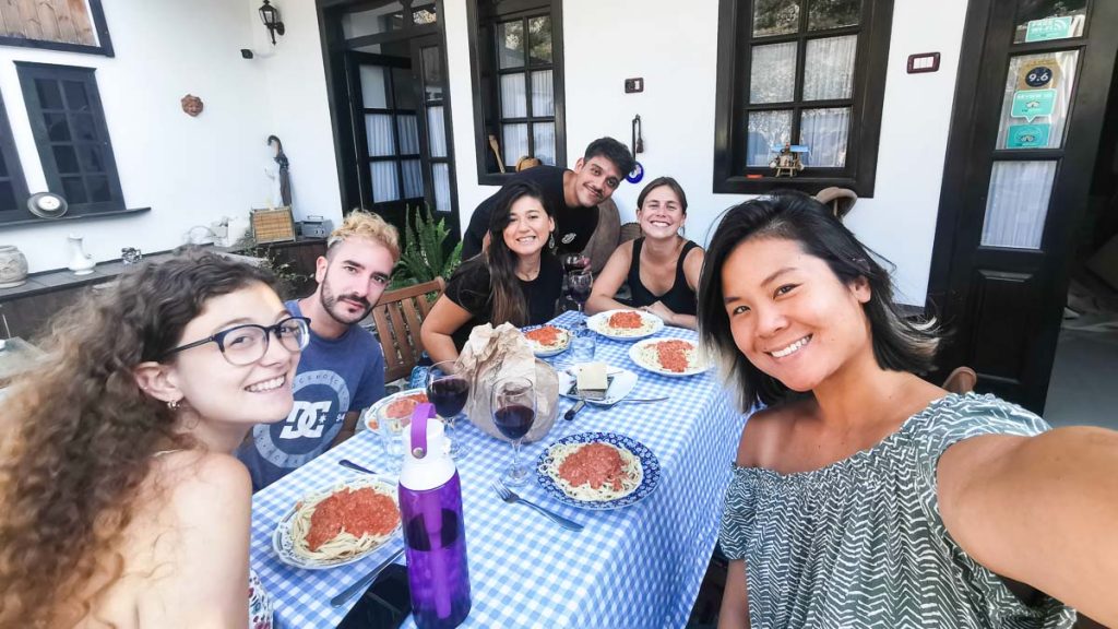 Eating Pasta with friends at hostel - Jane Tor