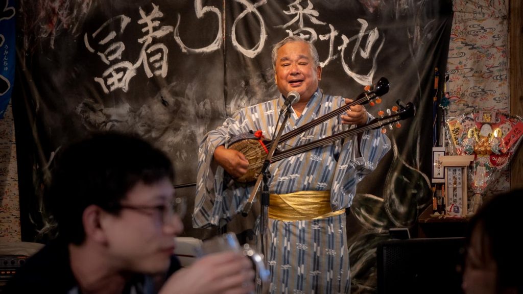 Okinawan folk singer performing sanshin - cultures explained Okinawa different from Japan-8
