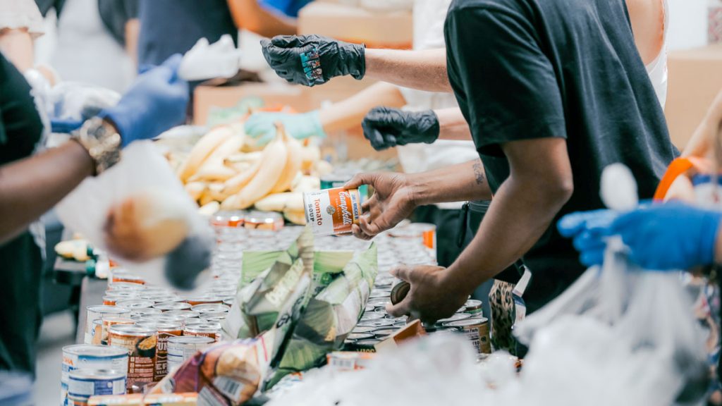 Volunteers distributing food to the needy — YEP-GO