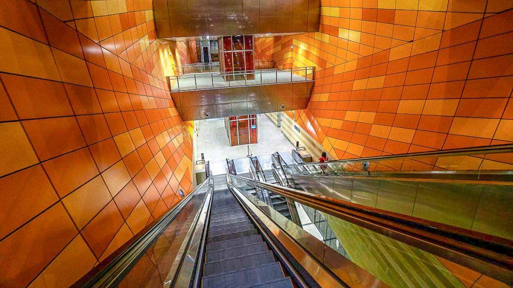 Girl on Escalator at Bencoolen Singapore MRT Station