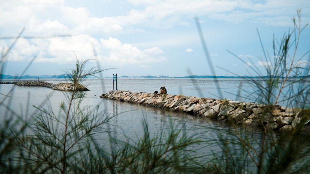 People sitting on the Breakwaters – Southern Islands