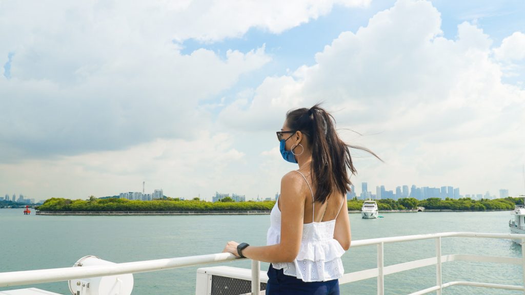 Girl on looking out into the horizon while on a Ferry