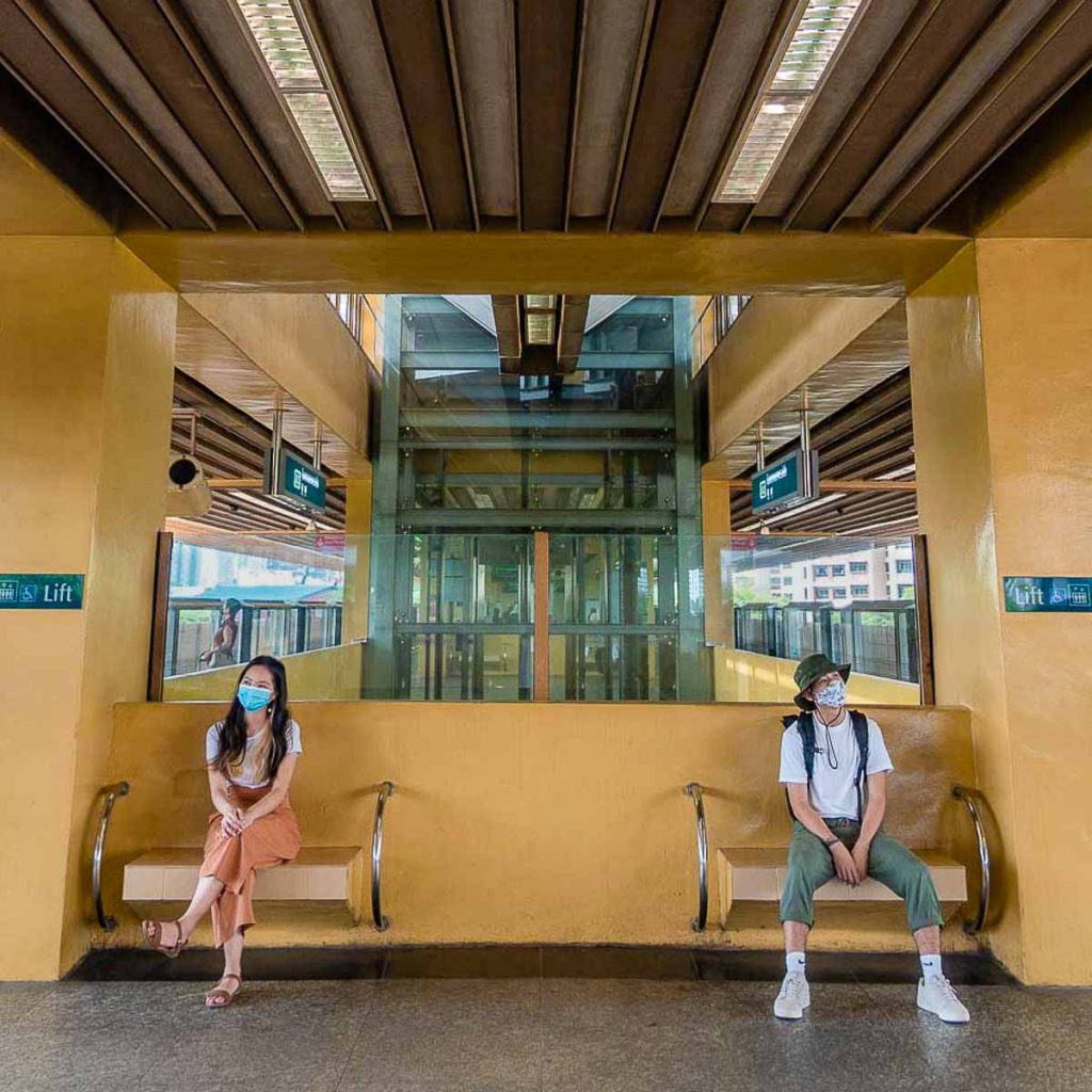 Couple Sitting Commonwealth Singapore MRT Station