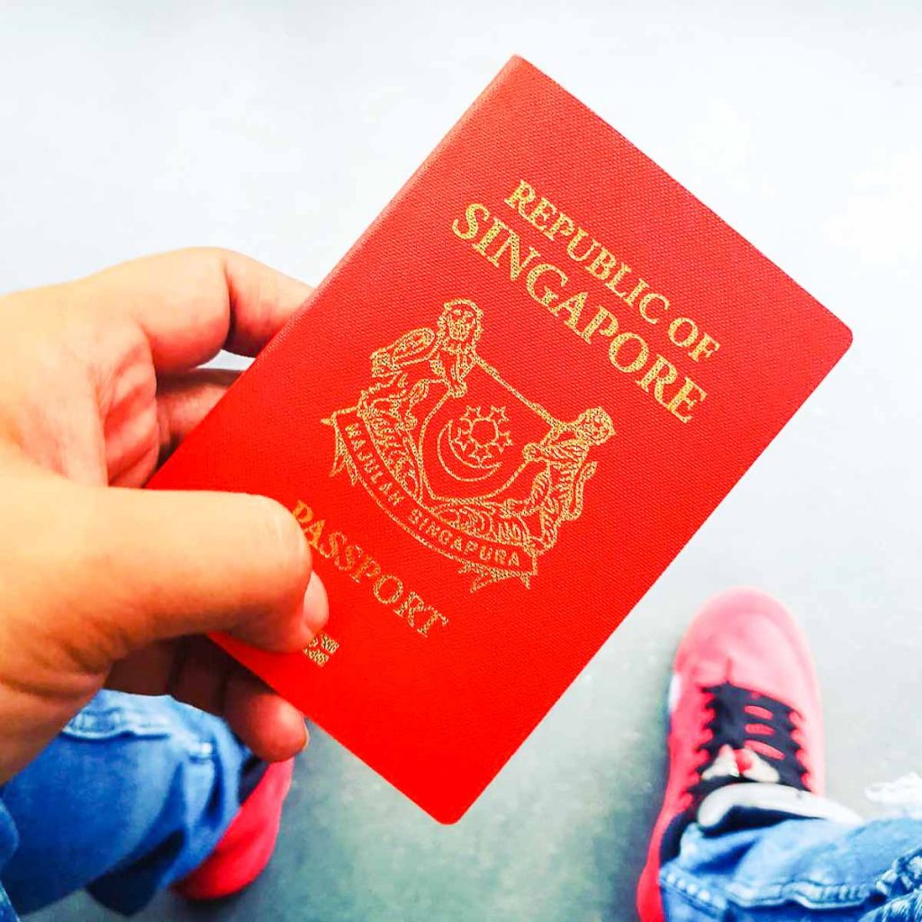 Holding onto Passport Singaporean Overseas