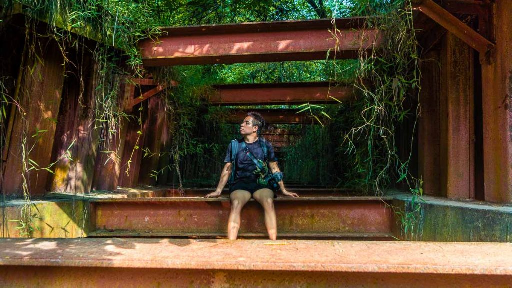 Boy on Red Metal Beams Near Clementi Forest