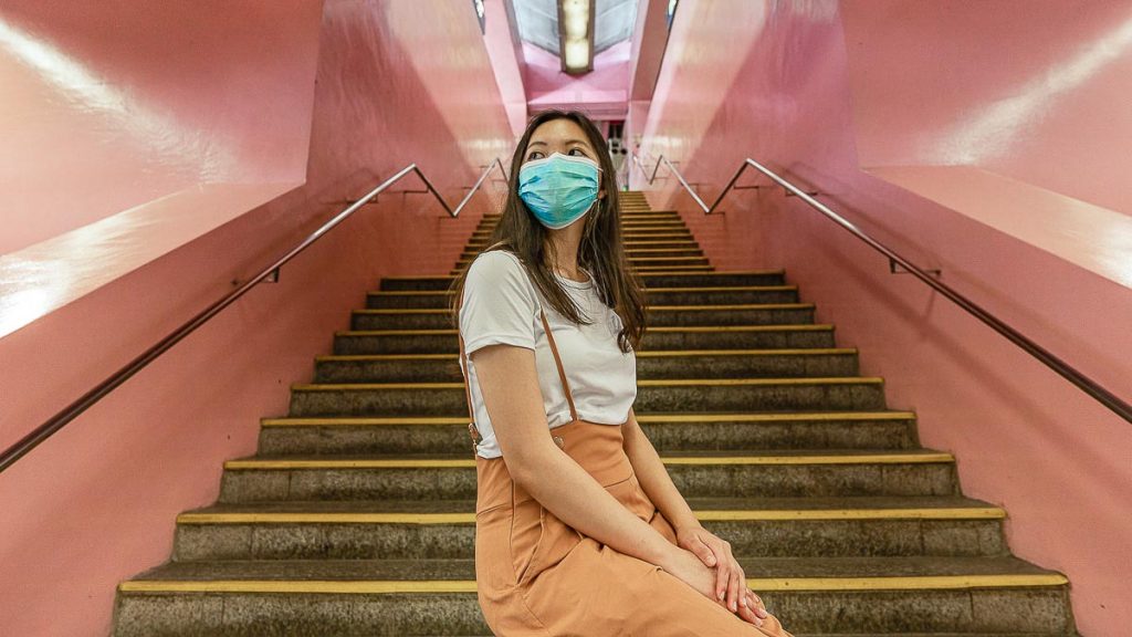 Girl Seated on Railing Redhill Singapore MRT Station