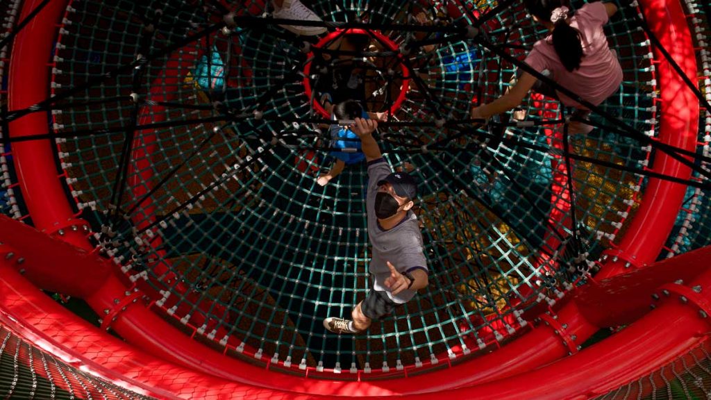 Boy on Coastal Playgrove at East Coast Park — Vertical Climbing Ropes