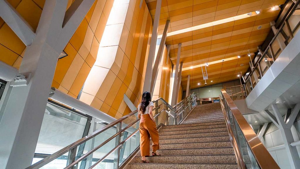 Girl Climbing Stairs at Woodlands Singapore MRT Station