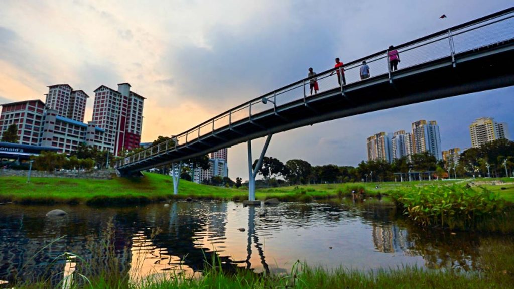 People Standing on a Bridge Bishan-Ang Mo Kio Park