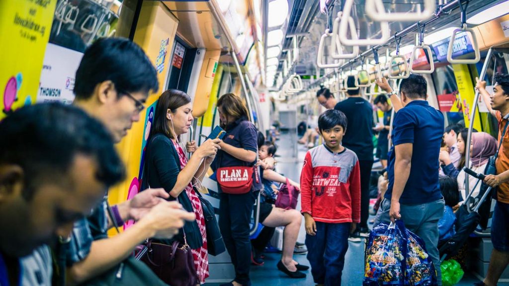 People on the train in Singapore