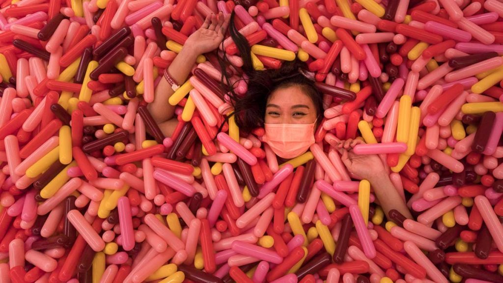 Laying in the world's largest sprinkle pool - Museum of Ice Cream