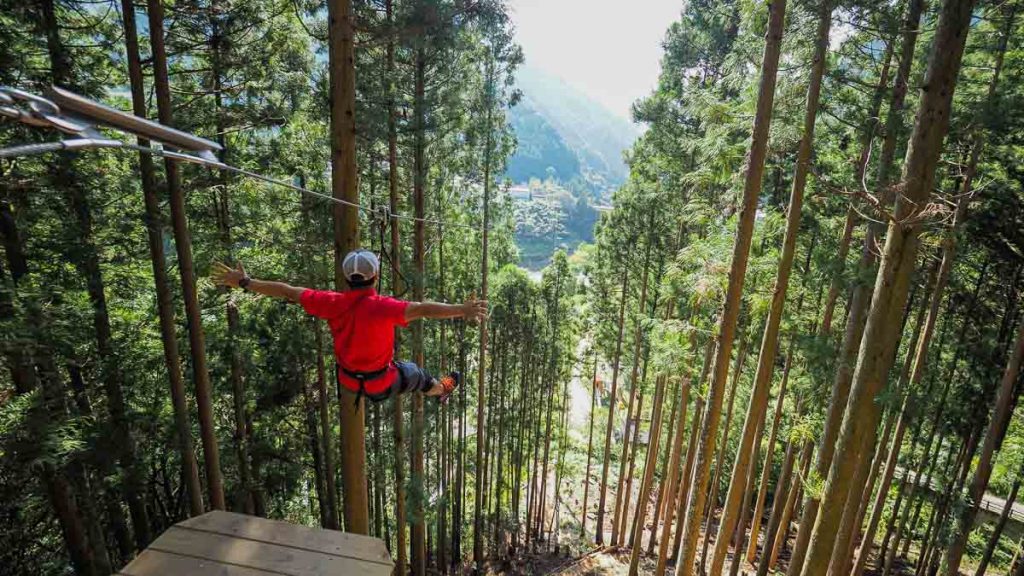 Man Ziplining at Iya Forest Adventure Guide to Shikoku