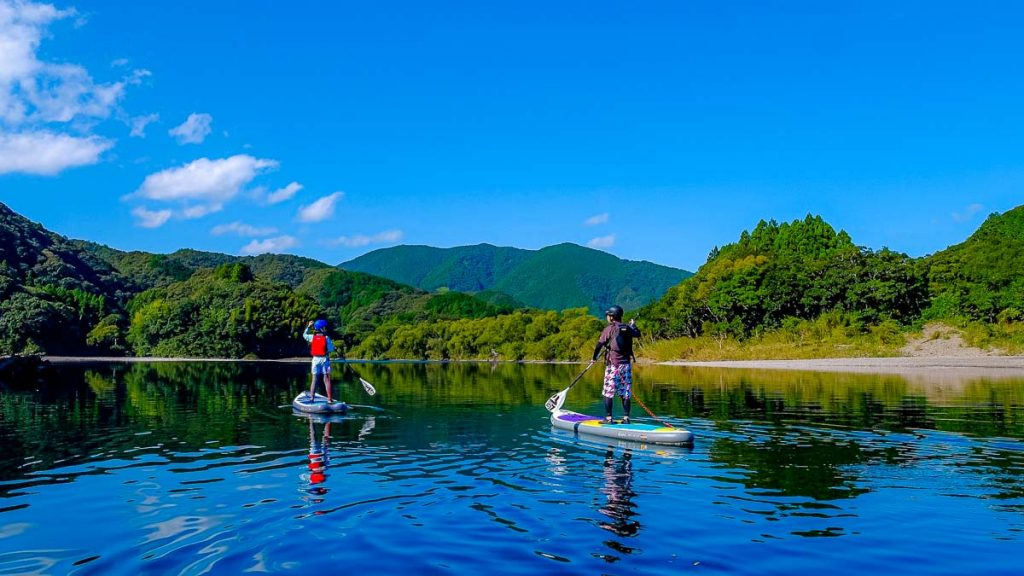 People Stand Up Paddling at Shimanto River
