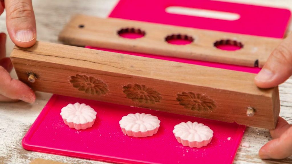 Person Making Sweets in a Mould