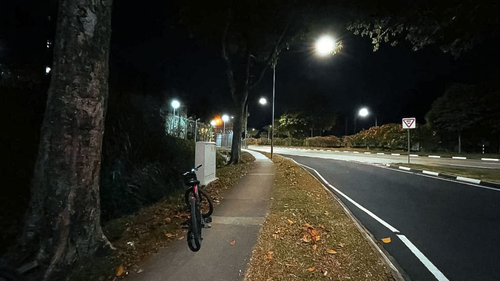 Bicycle parked by the roadside at night - Night Cycling Singapore