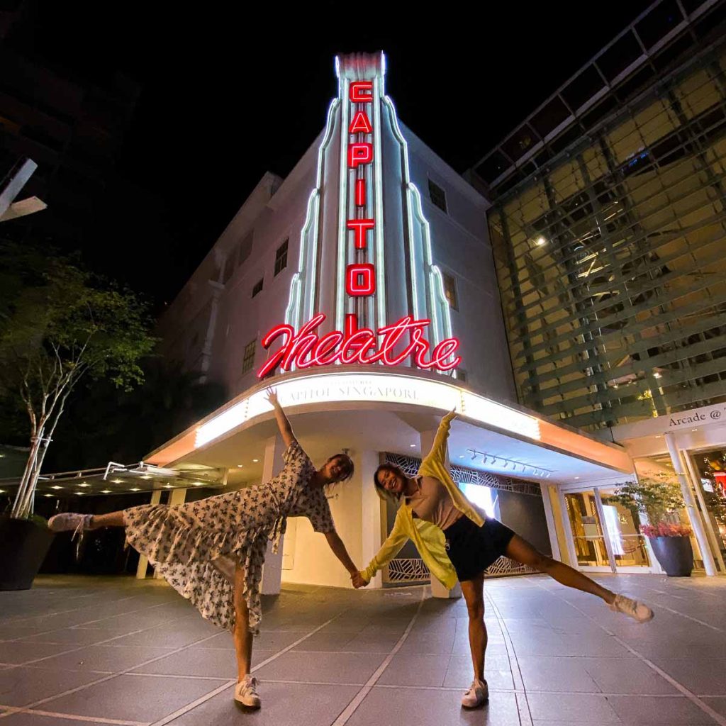 Two girls posing at Capitol Theatre - iPhone night photography