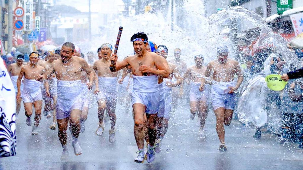 Men in Loincloth Running Under Water - Tohoku Region