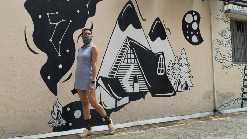Girl standing in front of monochrome mural in plumer road - Jalan Besar Neighbourhood Guide