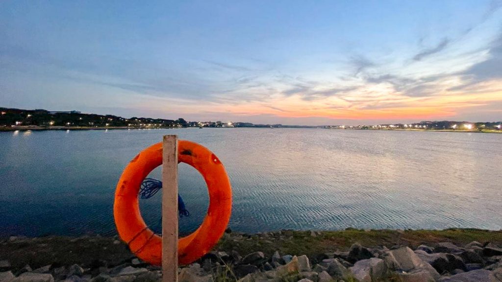 Lake with life buoy sunset - Night Cycling Singapore