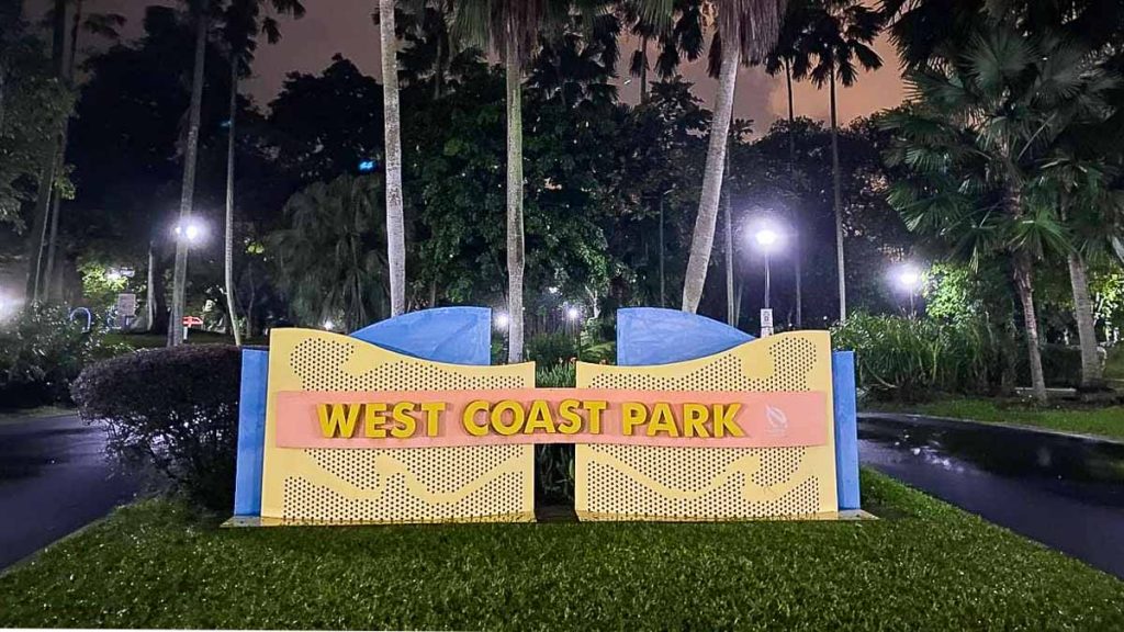 Yellow and blue sign in a park - Night Cycling Singapore