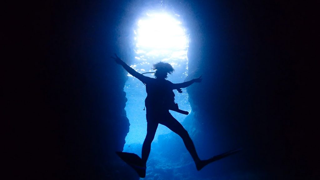 Man Scuba Diving at Blue Cave - Japan Outdoor Adventures