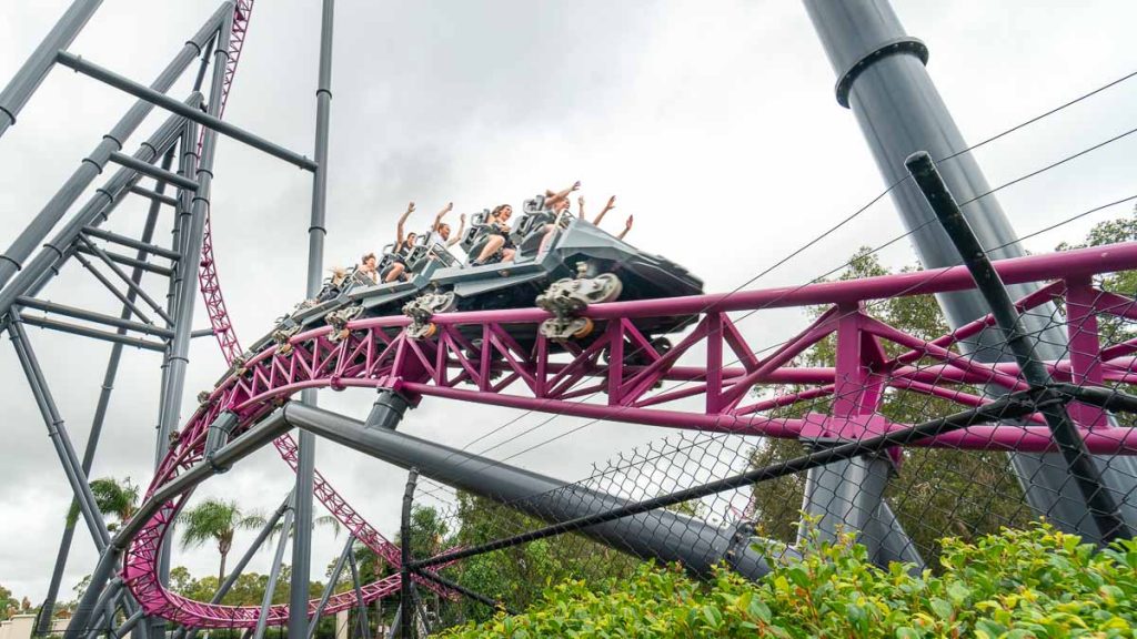 People Riding DC Coaster - Things to do in Queensland